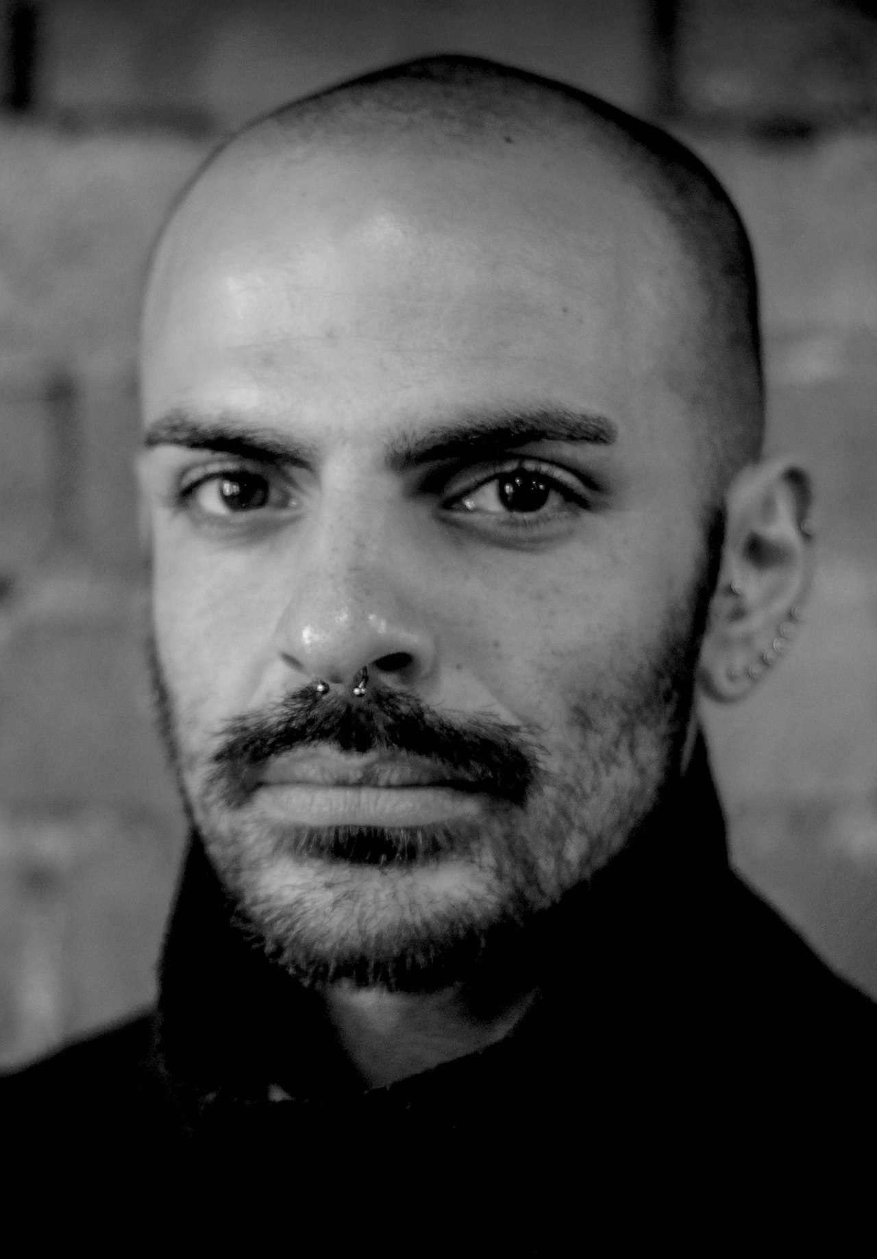 Israel Aloni headshot B&W photo by Adam Wheeler