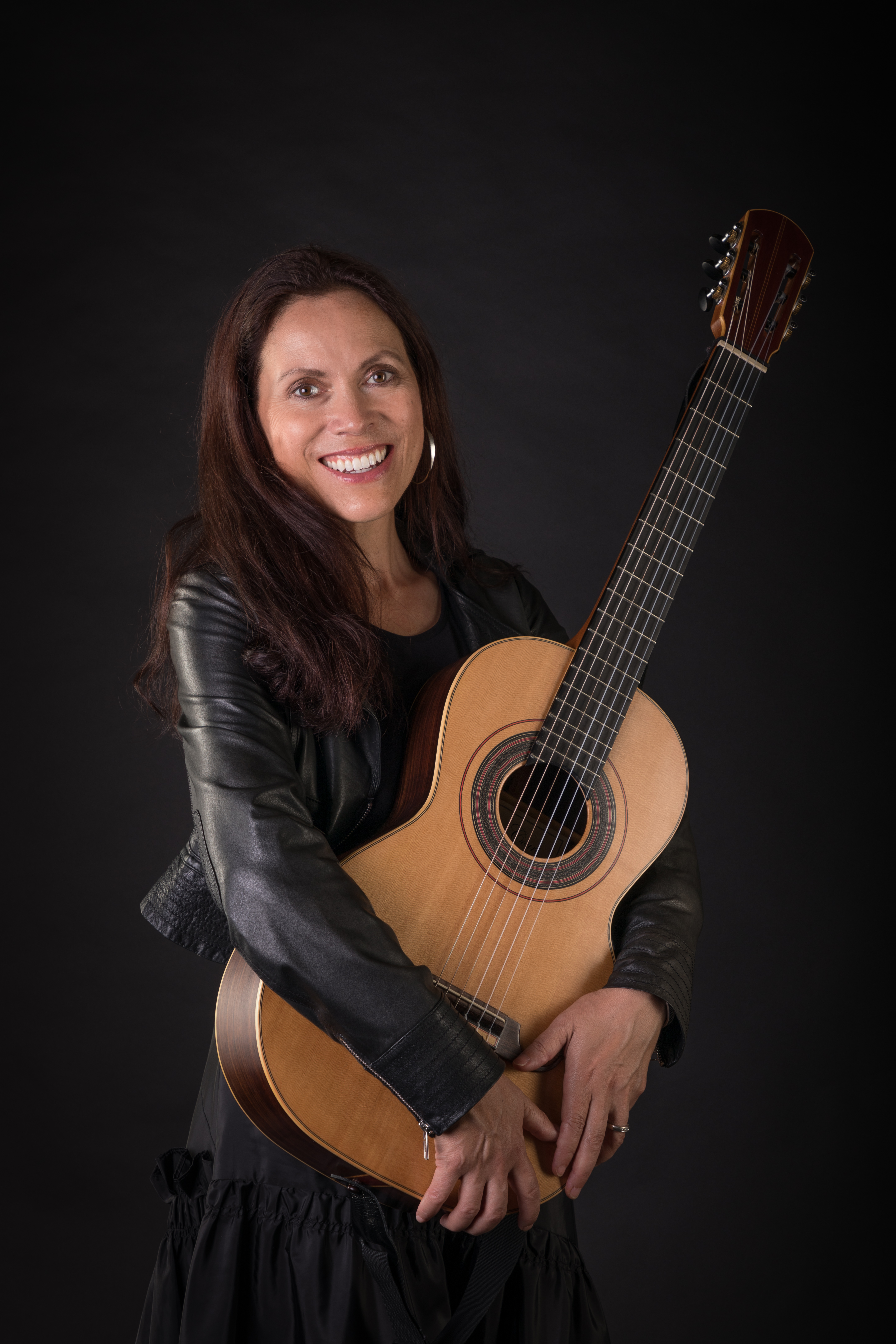 Deborah Wai Kapohe Guitar and Leather Jacket